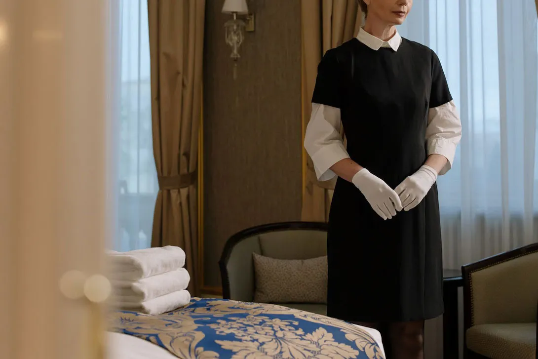 A lady cleaning a hotel